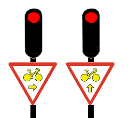 Les panneaux permettant aux vélos de passer au feu rouge.